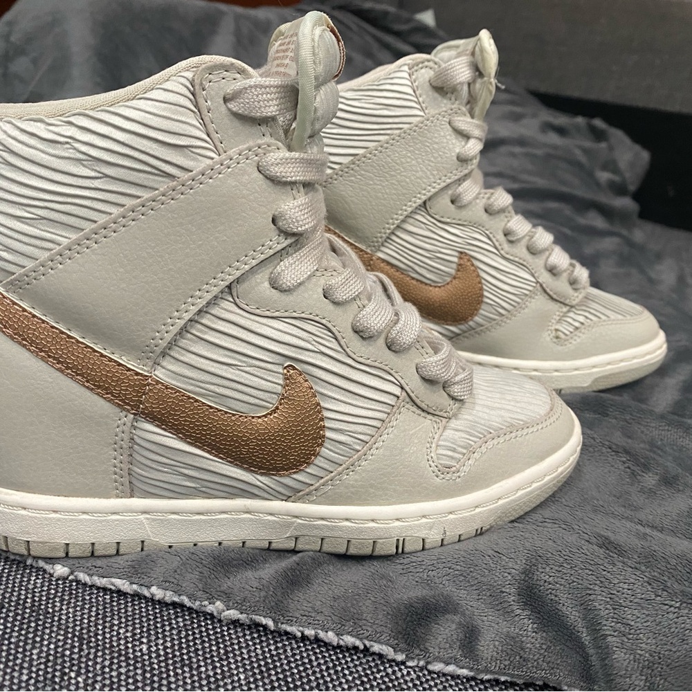 Nike wedge sneakers with Gold Swoosh. Silk pleated sides. Worn only few times.